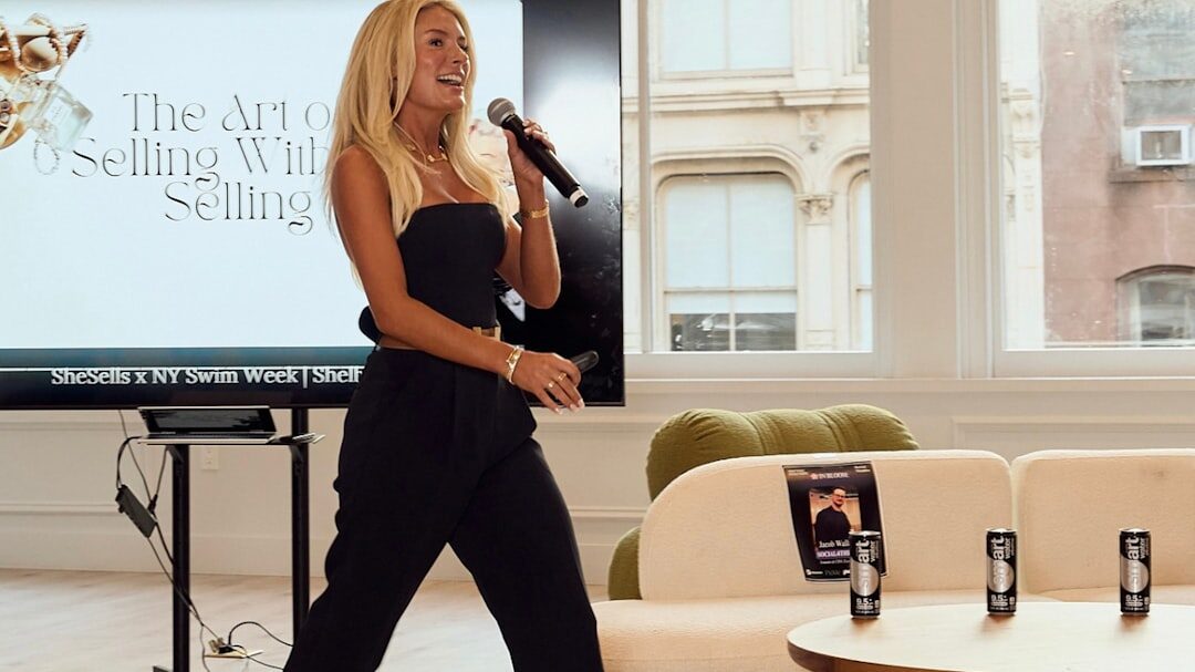 tv presenter smiling on stage