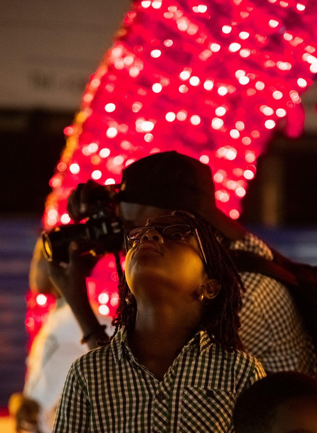 Photographers and flashing cameras at a red carpet entertainment event