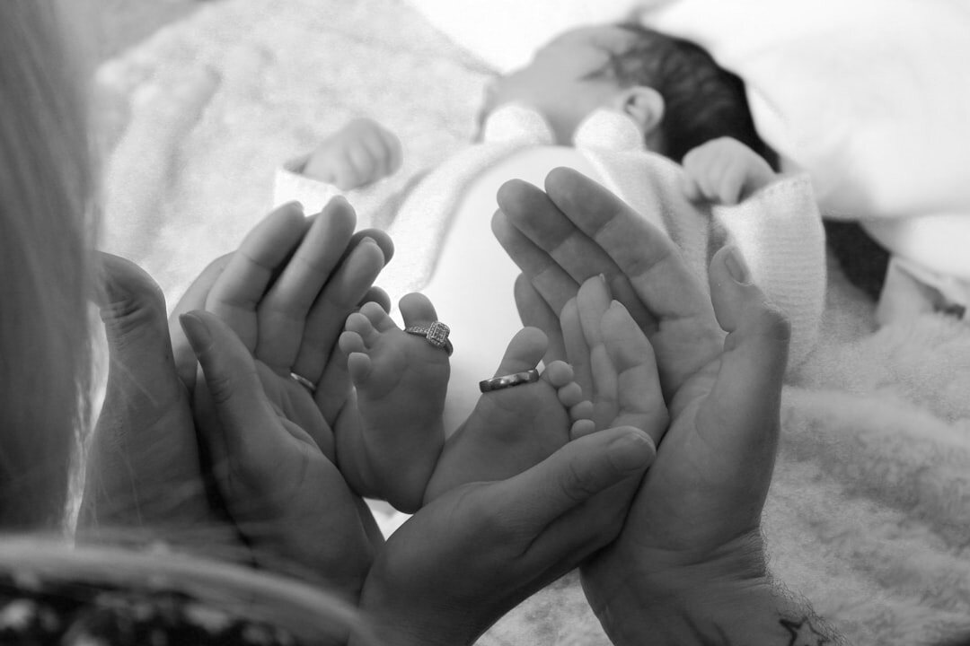 football player with newborn baby