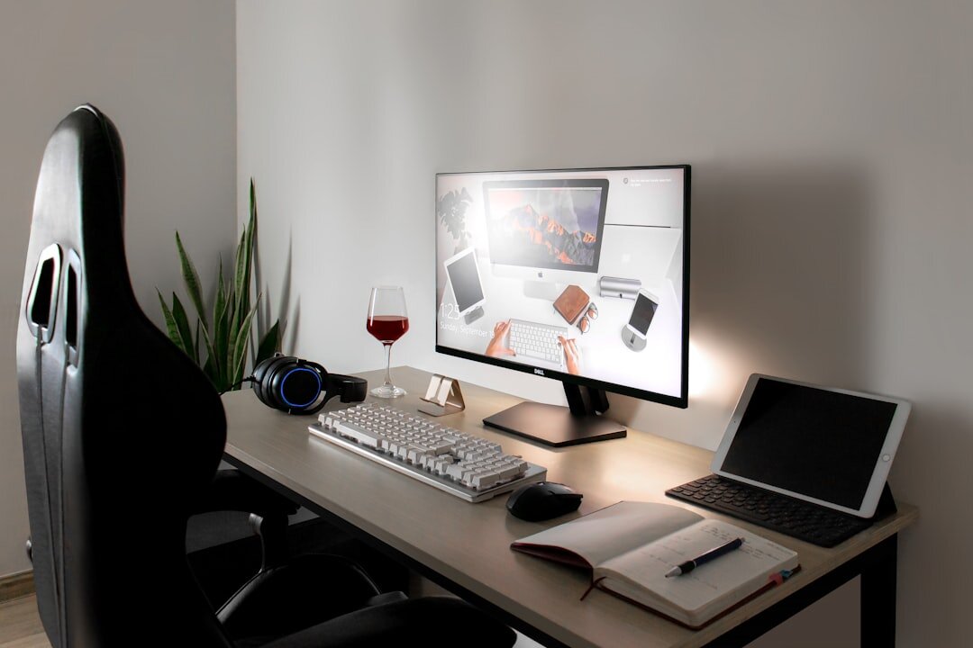 Bright modern editorial office with desks and monitors